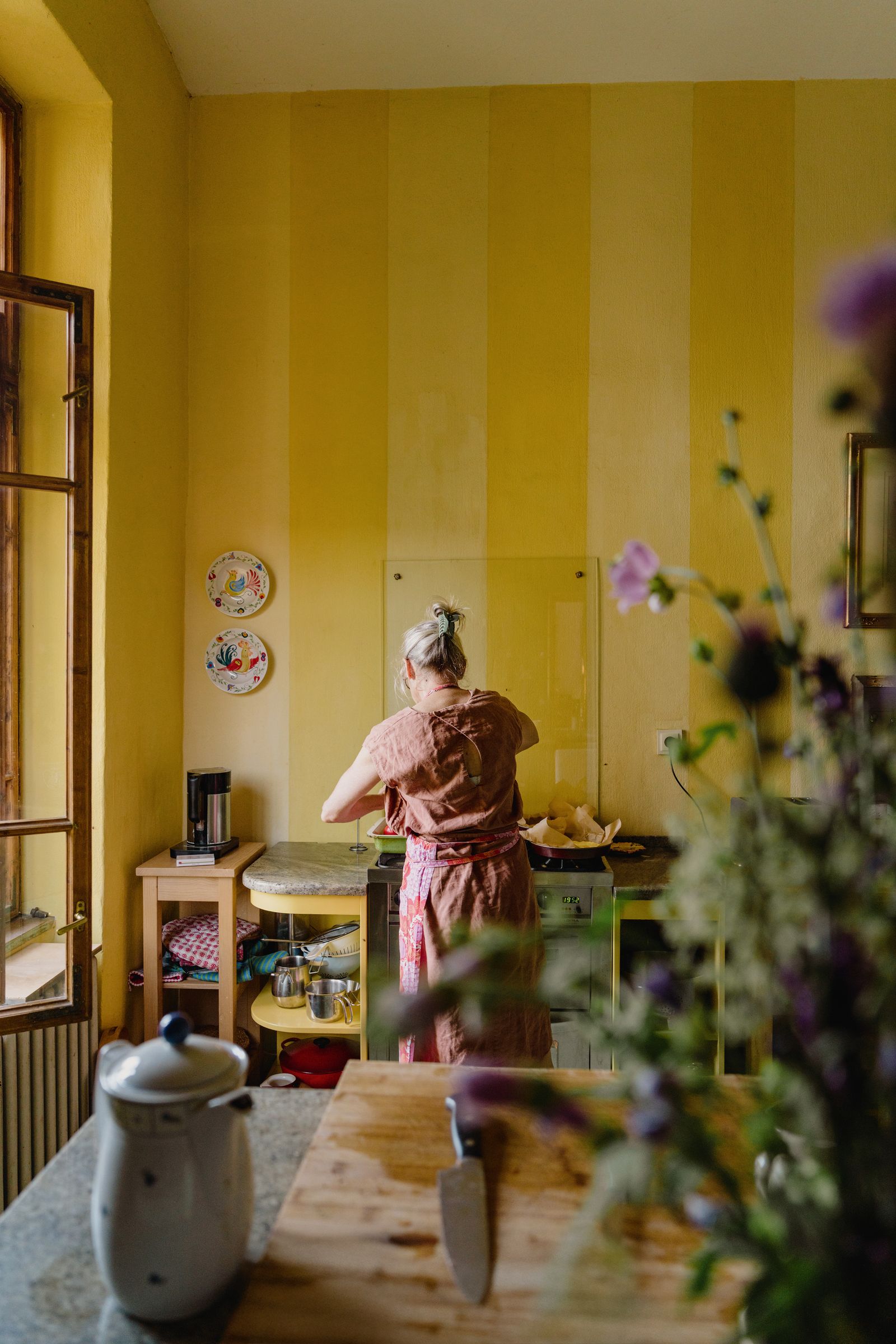 Image may contain Architecture Building Dining Room Dining Table Furniture Indoors Room Table Adult and Person