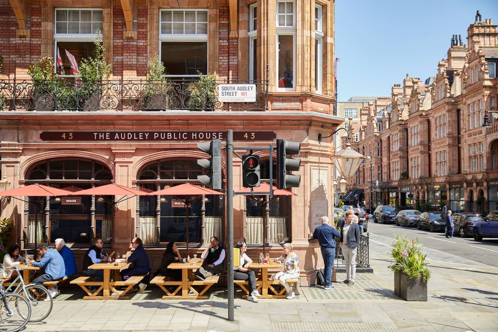 Image may contain Cafe Indoors Restaurant Urban City Cafeteria Road Street Adult Person Architecture and Building