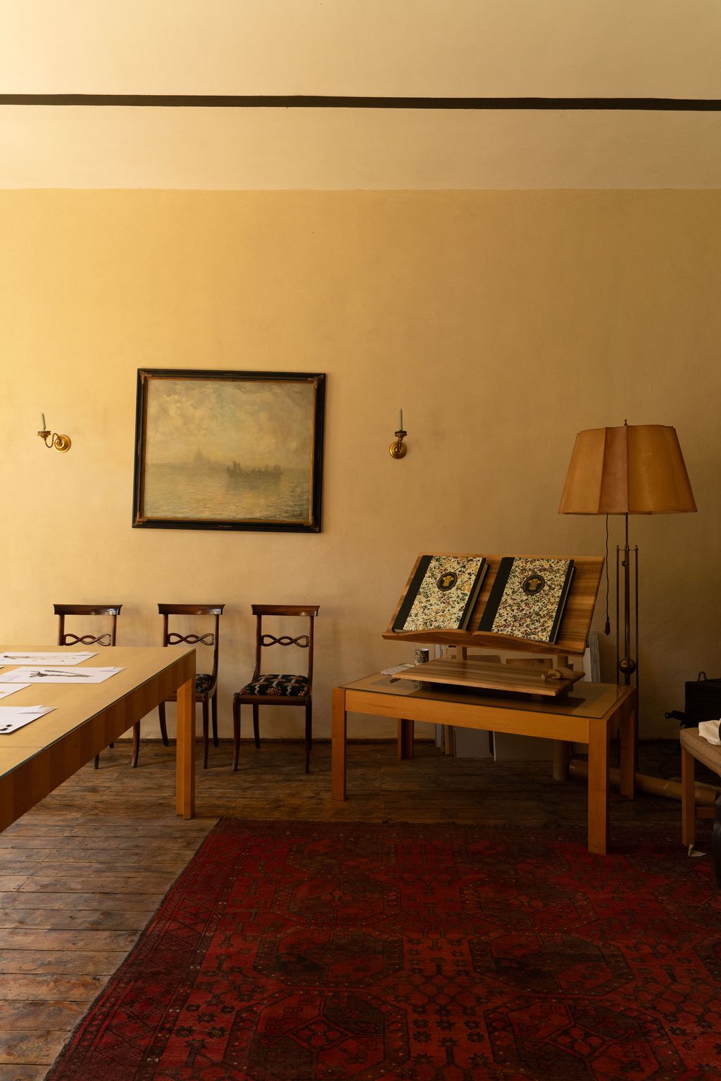 Image may contain Lamp Home Decor Chair Furniture Indoors Interior Design Table Architecture and Building