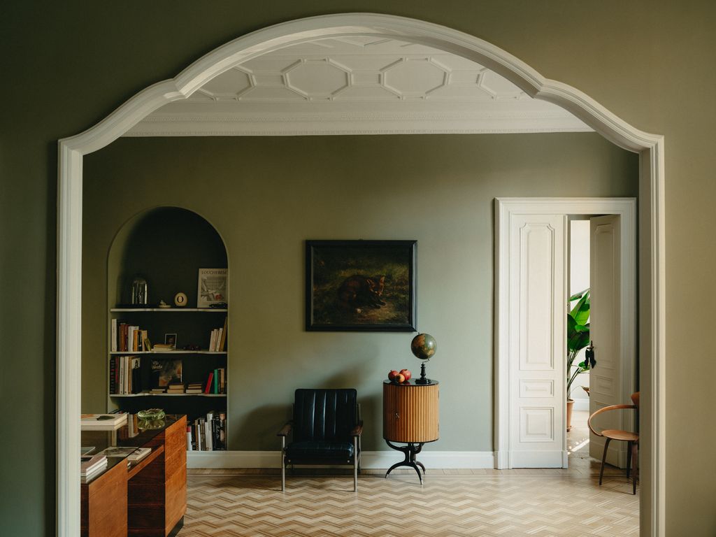 Image may contain Indoors Interior Design Chair Furniture Floor Home Decor Art Painting Architecture and Building