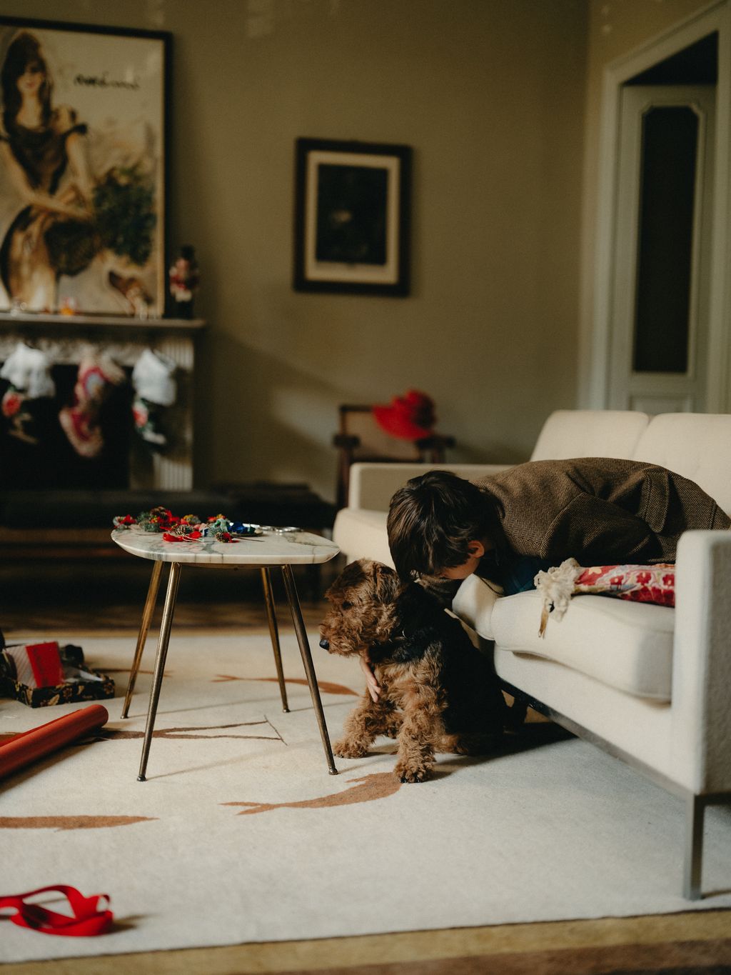 Image may contain Couch Furniture Adult Person Home Decor Architecture Building Indoors Living Room and Room