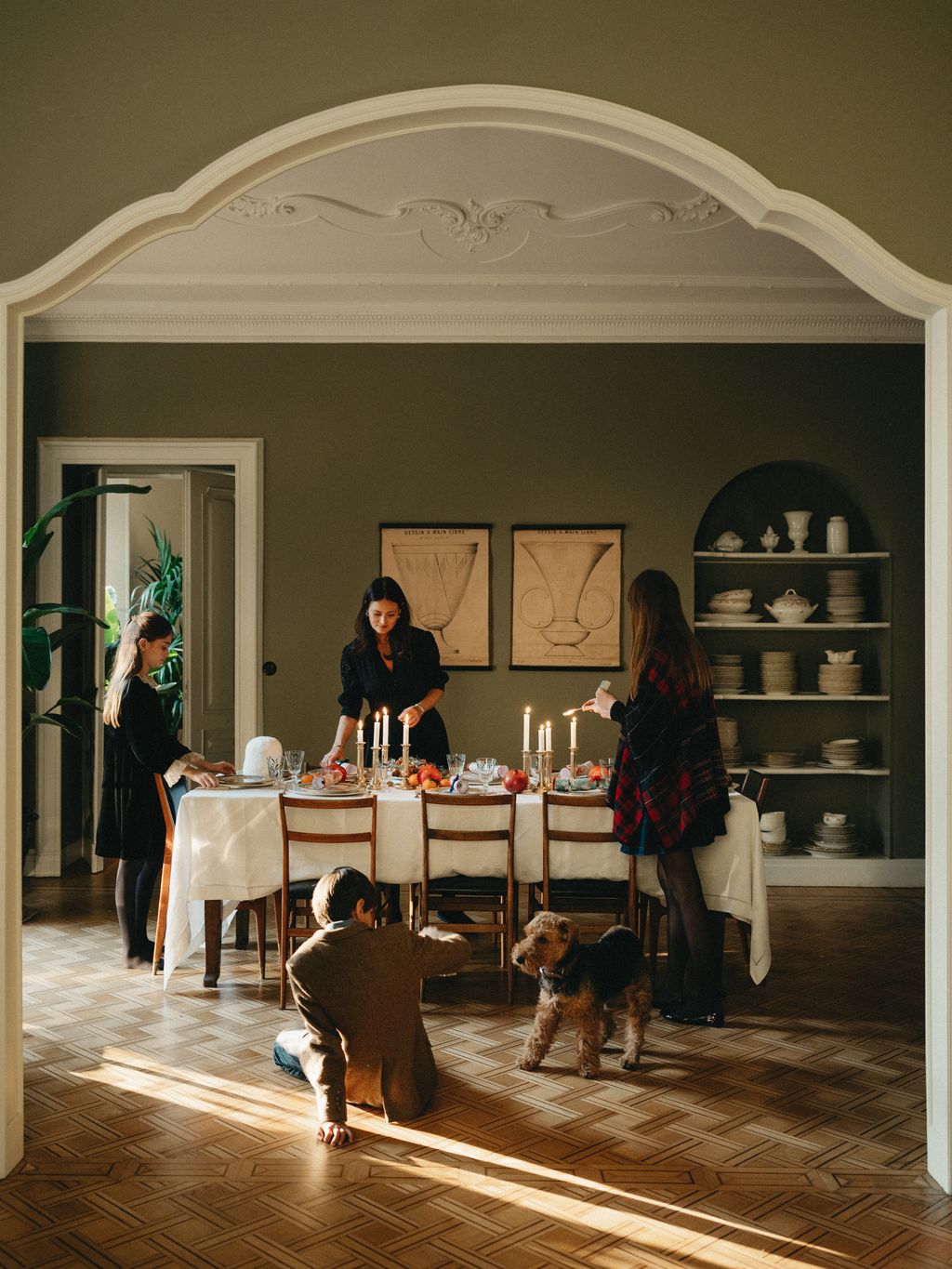 Celebrating Christmas with Mimi Thorisson at her Turin home  Mimi and children setting up the dinner table