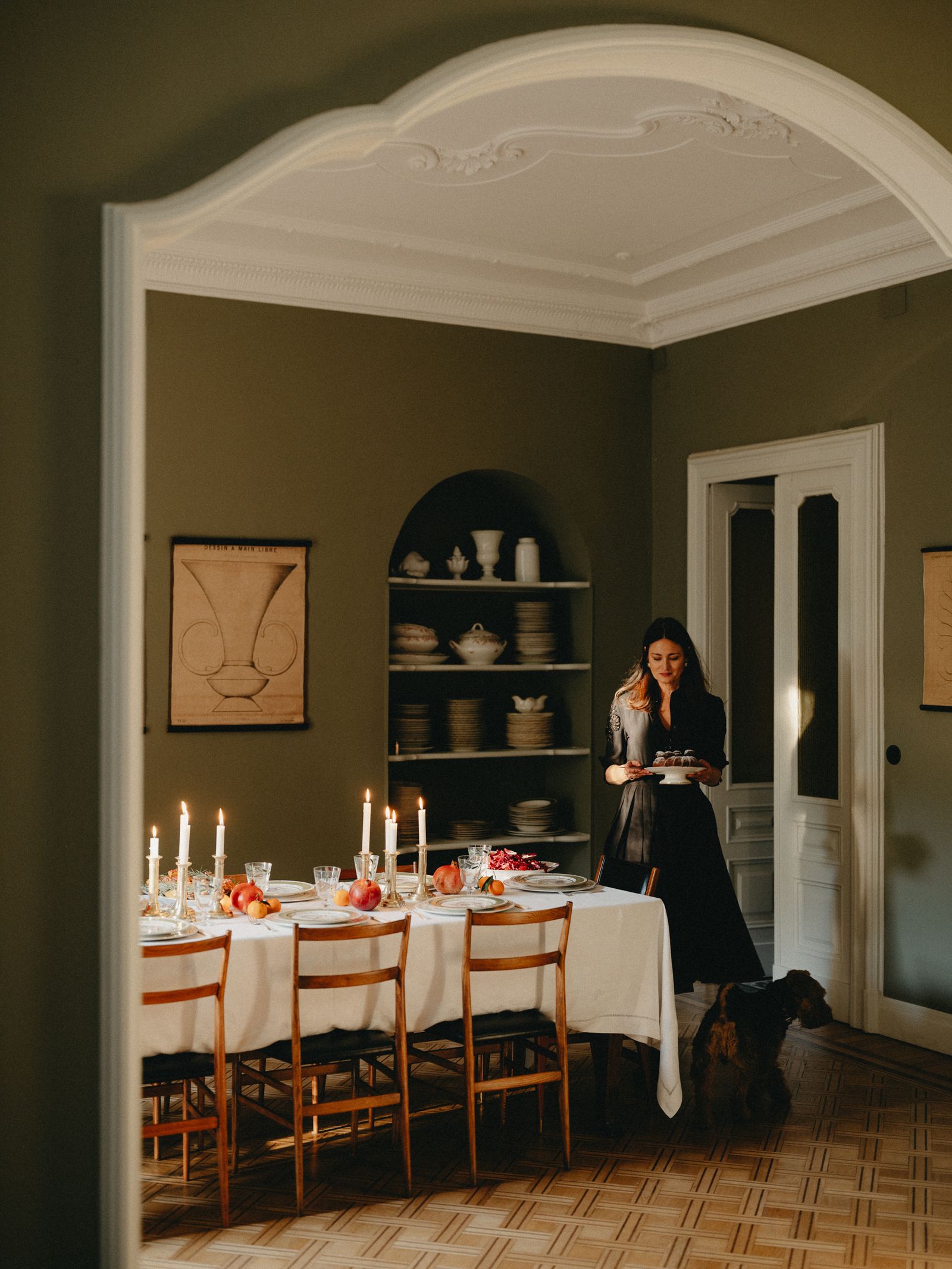 Image may contain Architecture Building Dining Room Dining Table Furniture Indoors Room Table Adult and Person