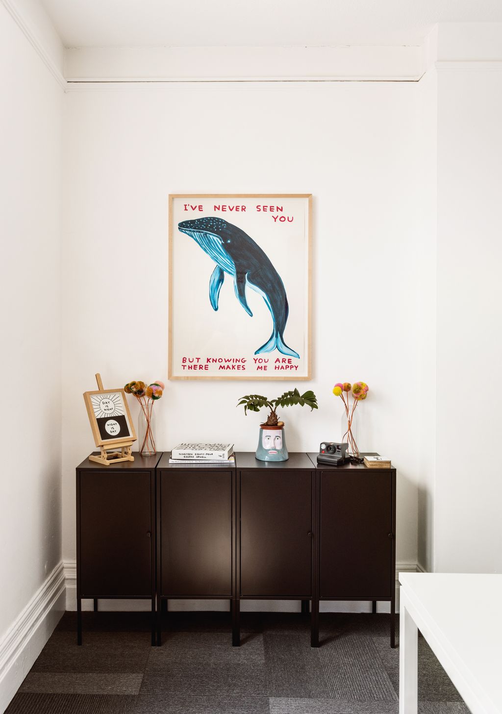 Image may contain Furniture Sideboard Plant Indoors Interior Design Table Desk Potted Plant Book and Publication