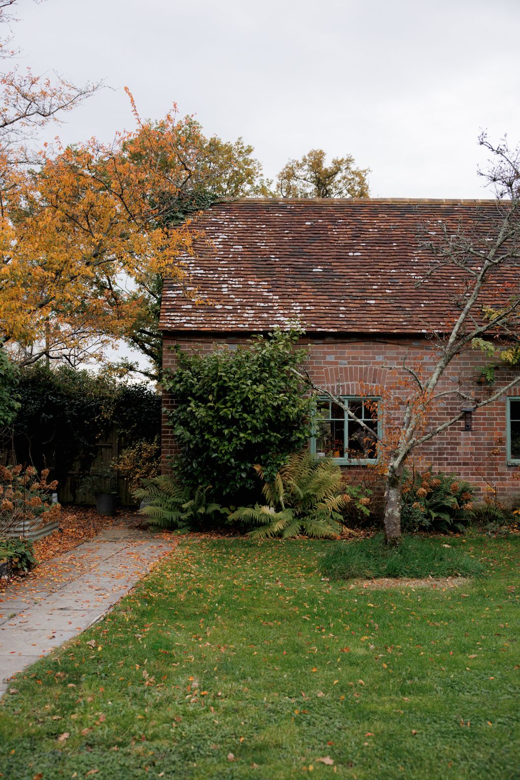 Image may contain Architecture Building Cottage House Housing Grass Plant Tree Outdoors and Nature