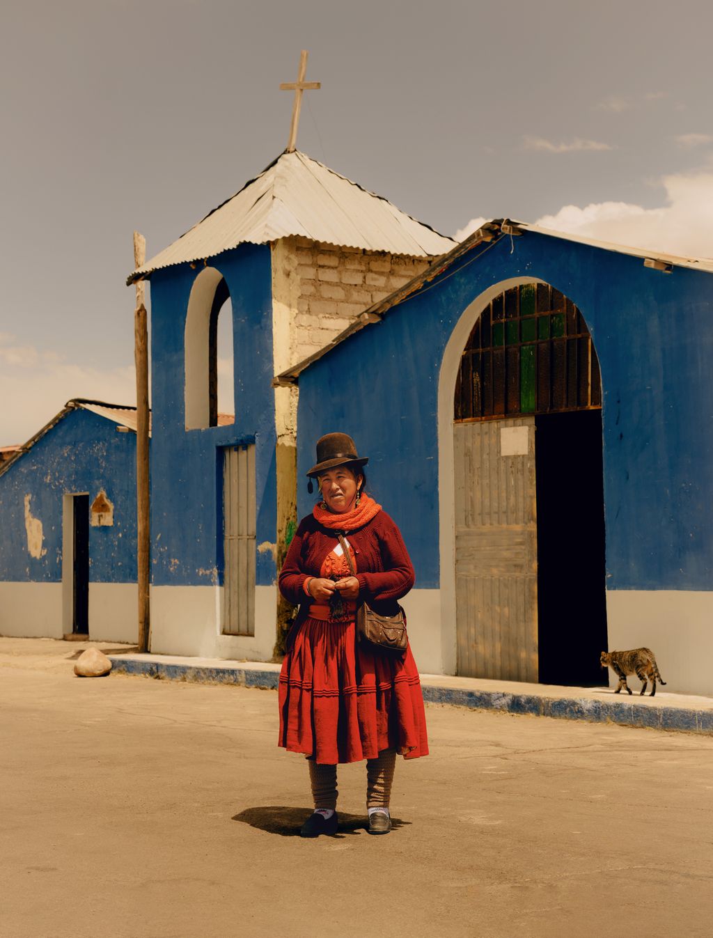 Image may contain Masashi Ozaki Clothing Skirt Adult Person Architecture Building Outdoors Shelter and Cross