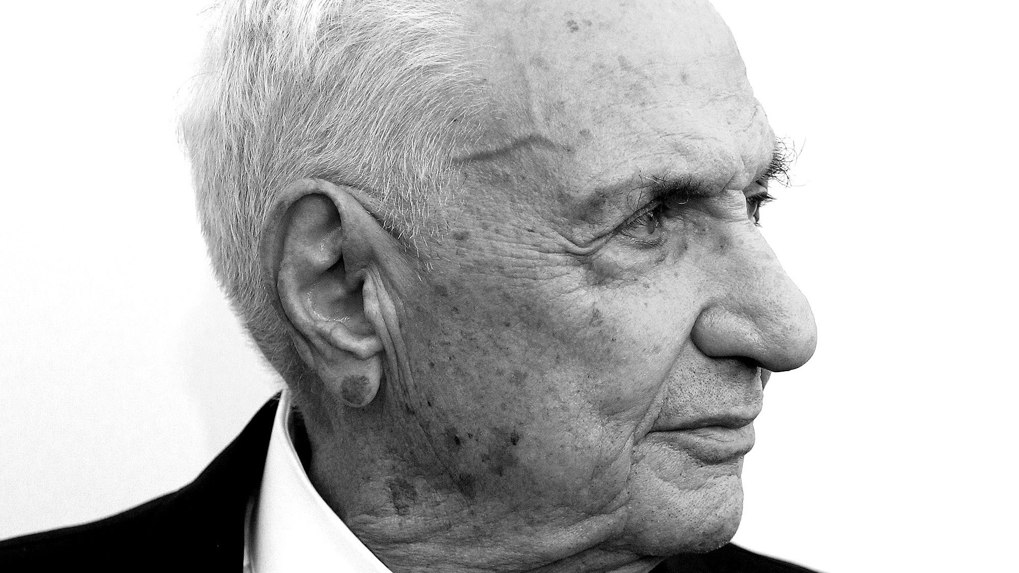Image may contain Frank Gehry Face Head Person Photography Portrait Accessories Formal Wear Tie Clothing and Suit