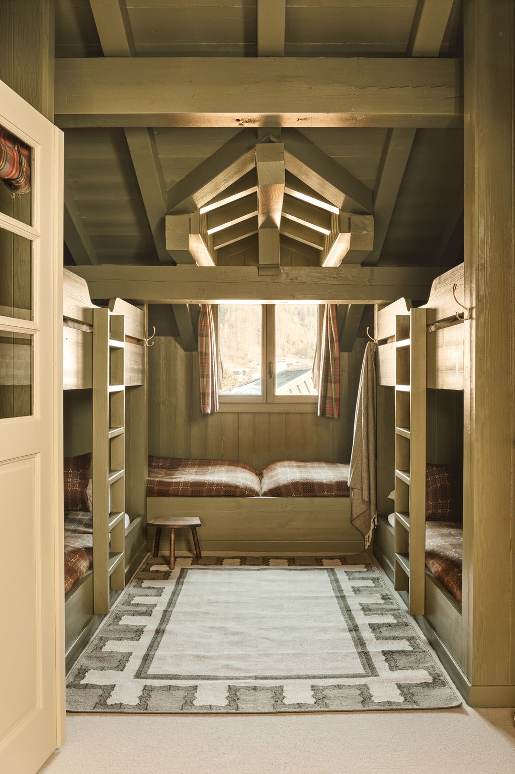 Image may contain Indoors Furniture Home Decor Rug Bed Bedroom Room Architecture Building and Housing