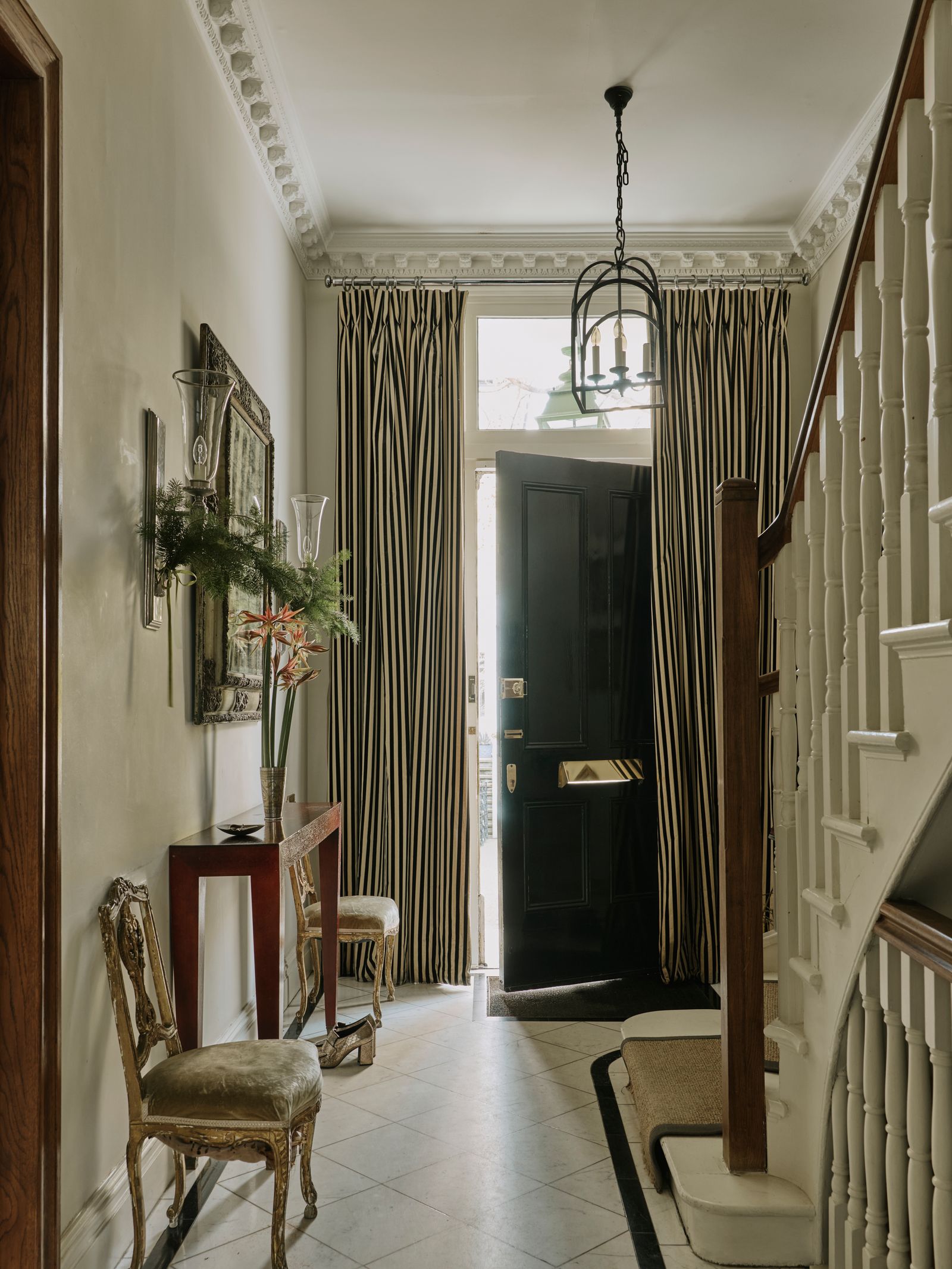 Image may contain Architecture Building Foyer Indoors Chair Furniture Clothing Footwear High Heel and Shoe