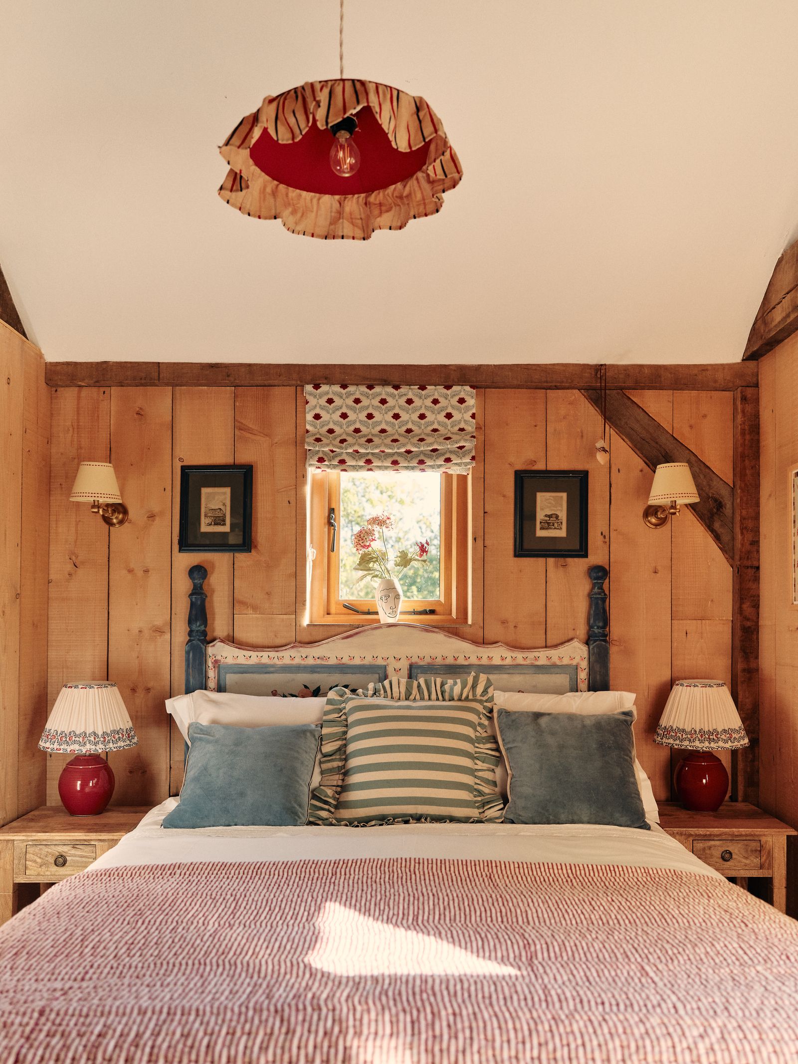 Image may contain Indoors Interior Design Cushion Home Decor Hardwood Stained Wood Wood Lamp Wood Panels and Bed