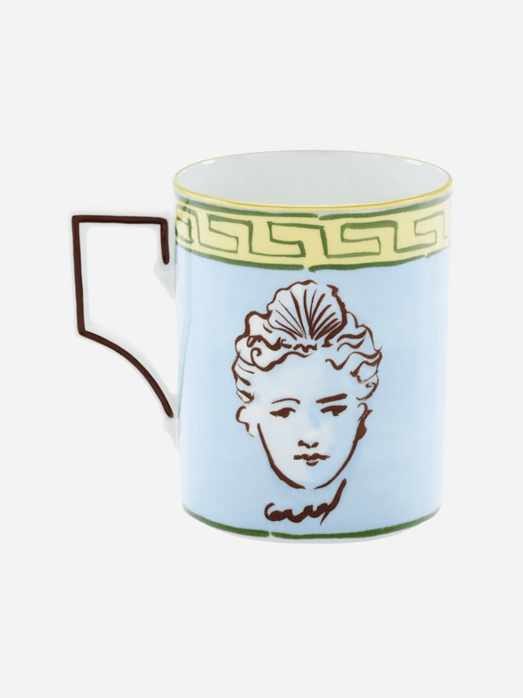 Image may contain: Adrienne Lecouvreur, Cup, Art, Porcelain, Pottery, Face, Head, Person, Baby, Beverage, and Coffee