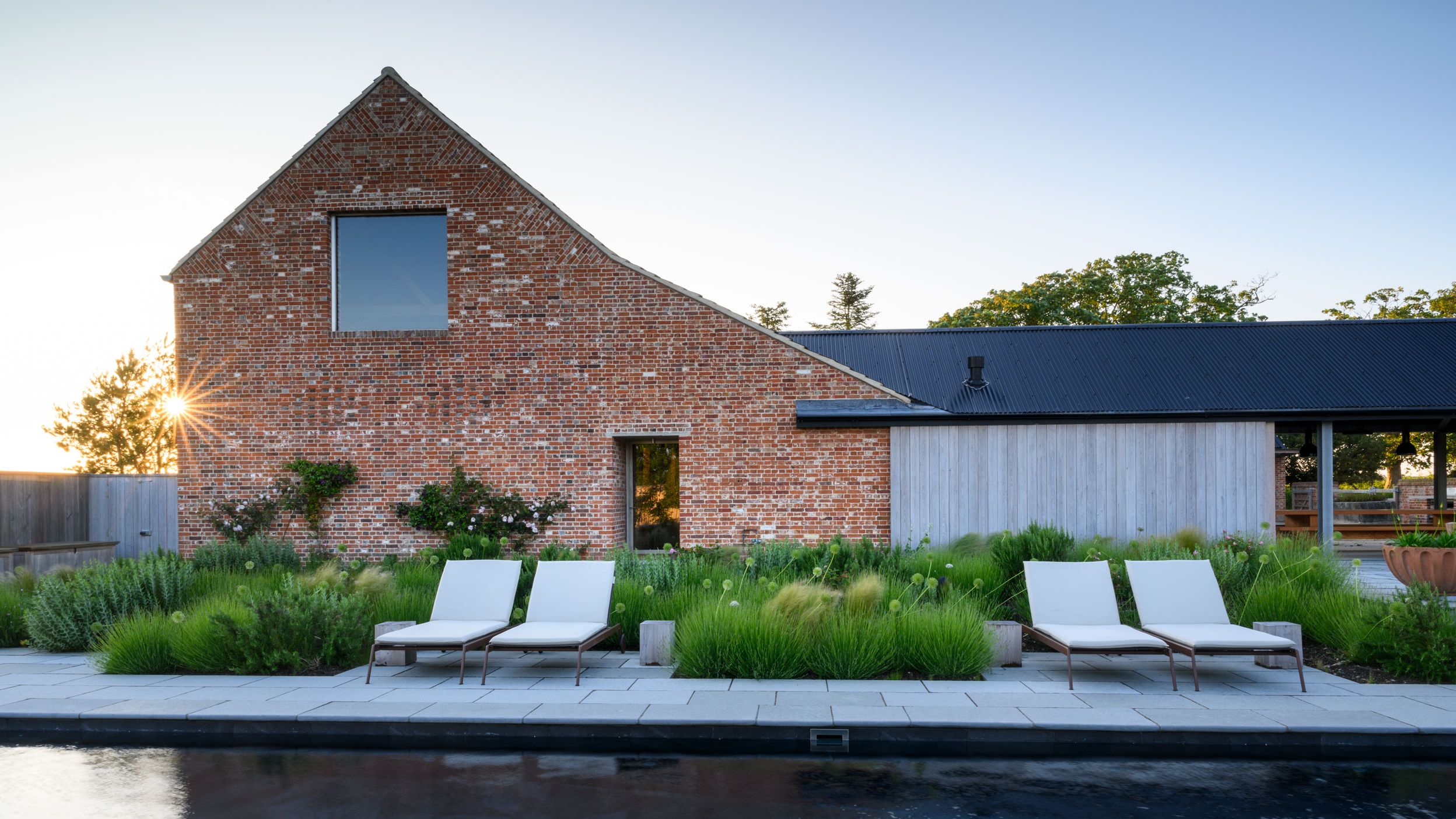 Image may contain: Backyard, Nature, Outdoors, Yard, Grass, Plant, Pool, Water, Chair, Furniture, and Indoors