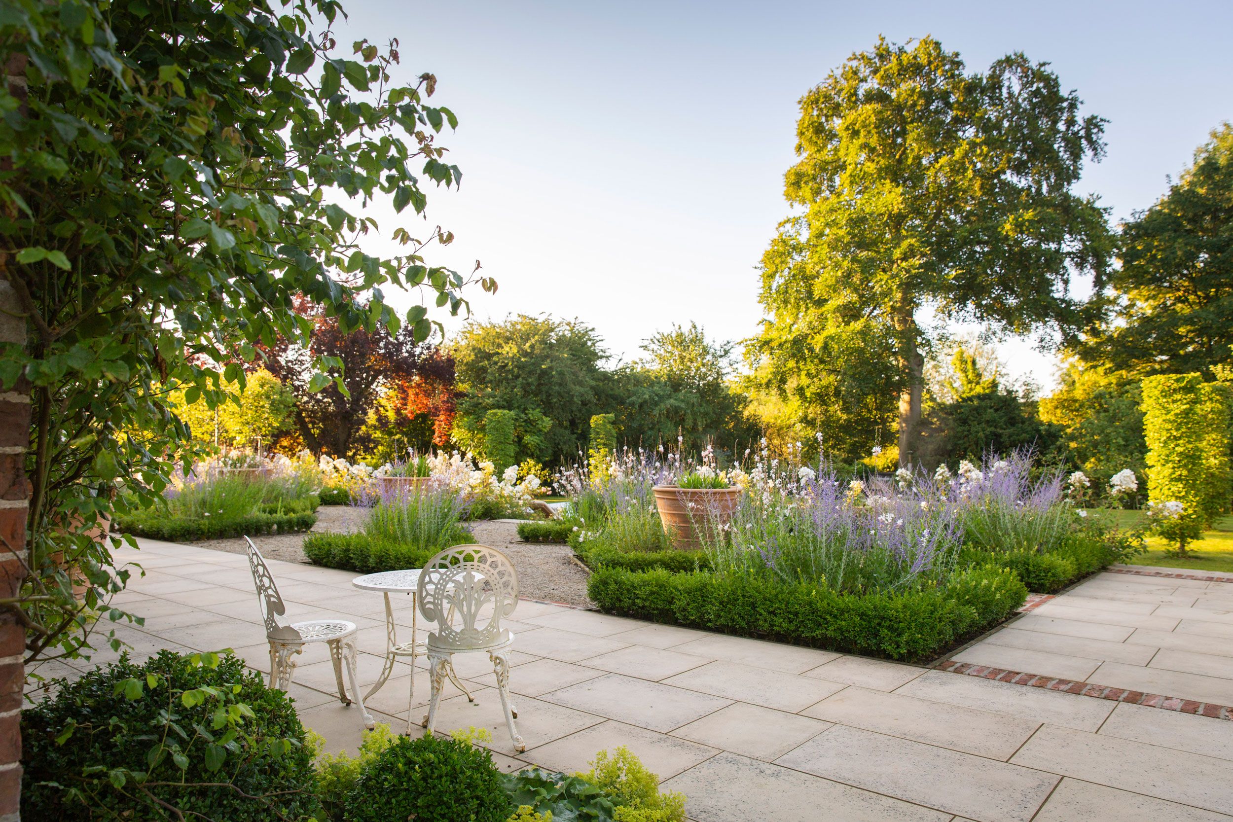 Image may contain: Grass, Nature, Outdoors, Park, Plant, Garden, Backyard, Yard, Path, Walkway, Chair, and Furniture