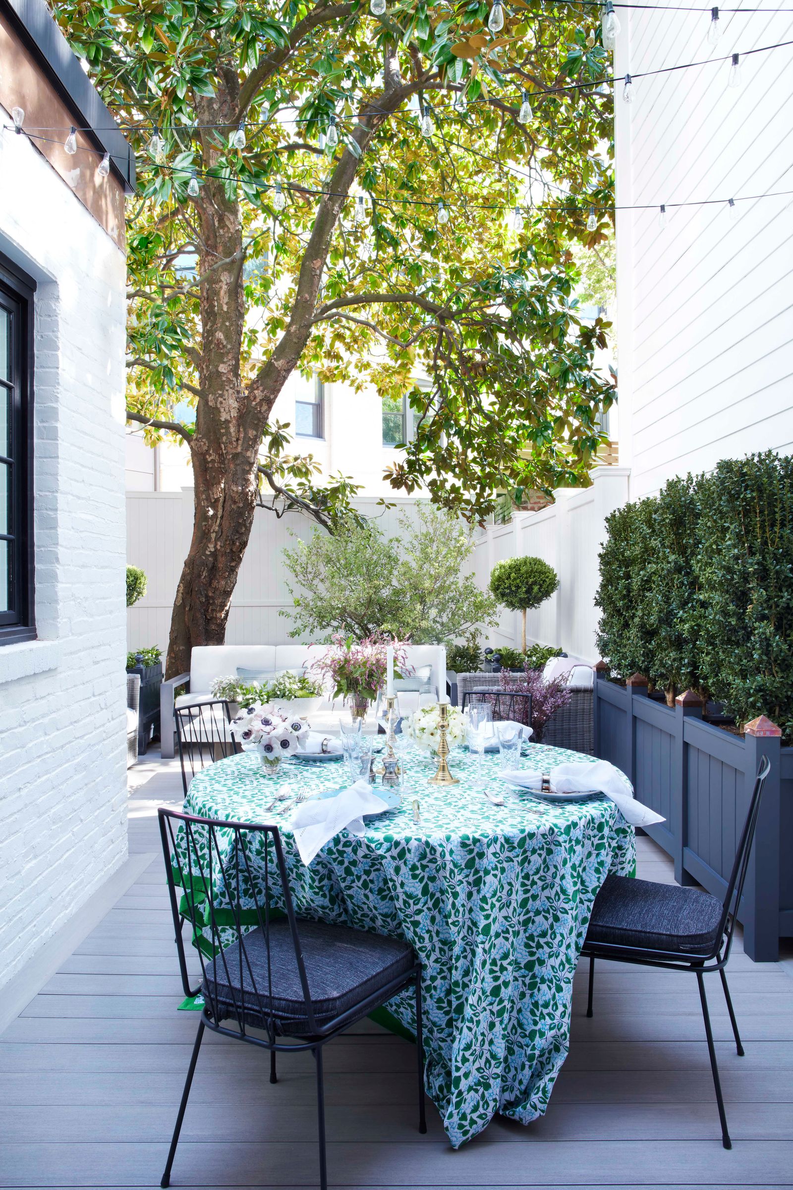 outdoor dining terrace with boxed plants landscape