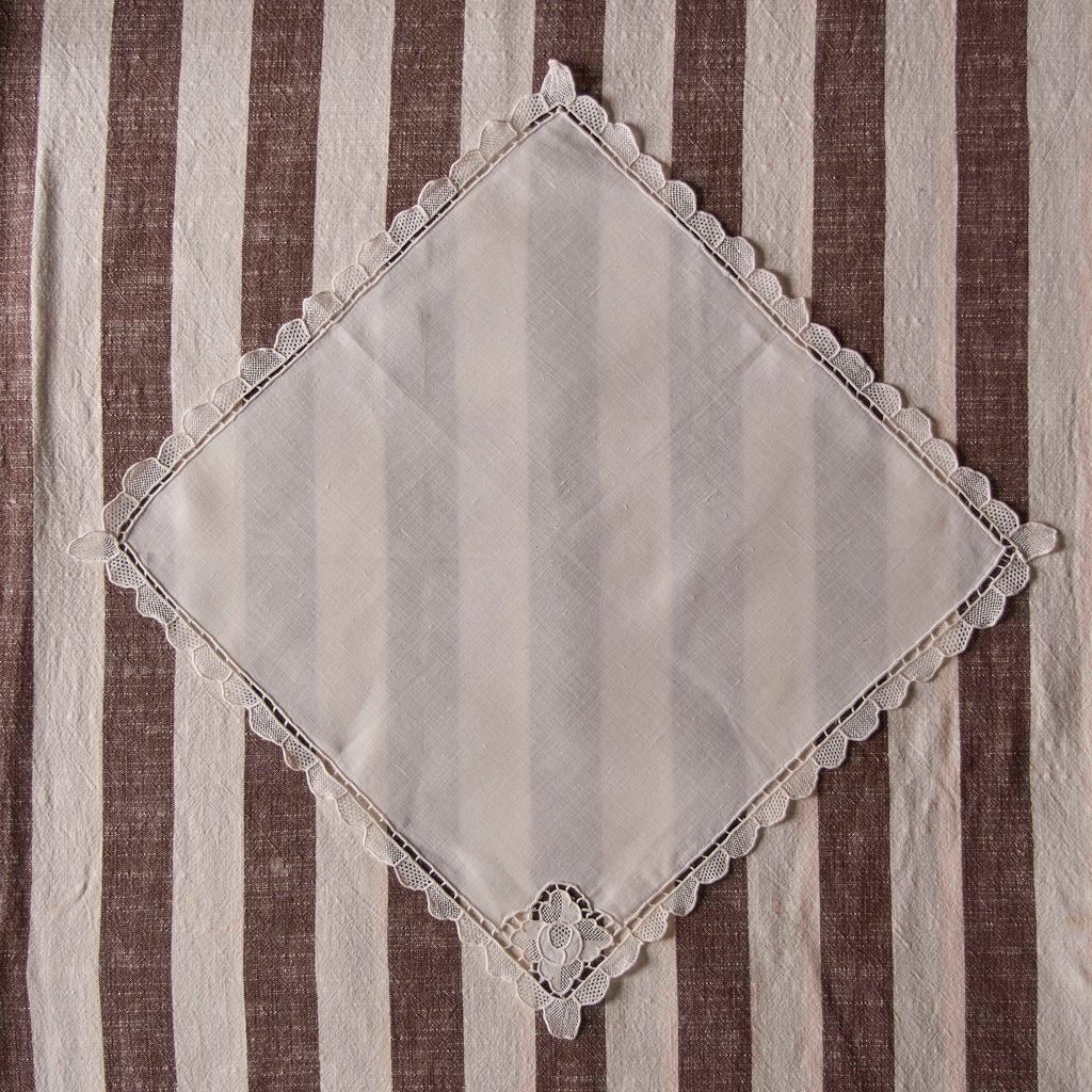 Image may contain Home Decor Tablecloth Linen and Napkin