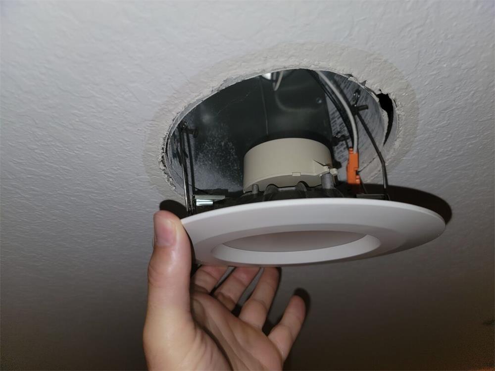 How to Adjust the Ceiling Hole Size for a Light Fixture
